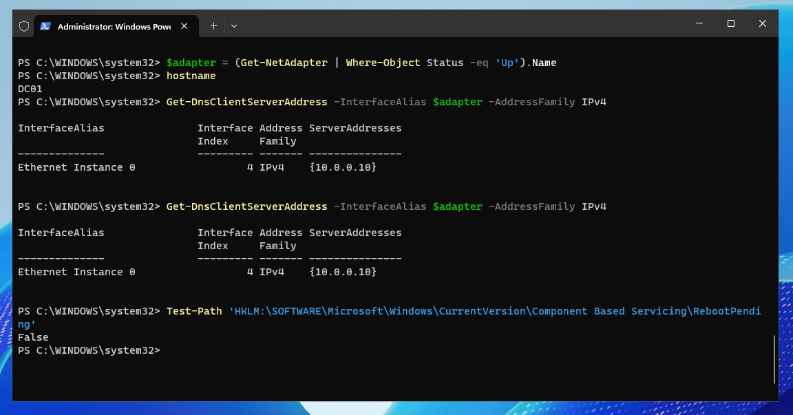 PowerShell output showing hostname, IP configuration, DNS settings, and reboot status before domain controller promotion.